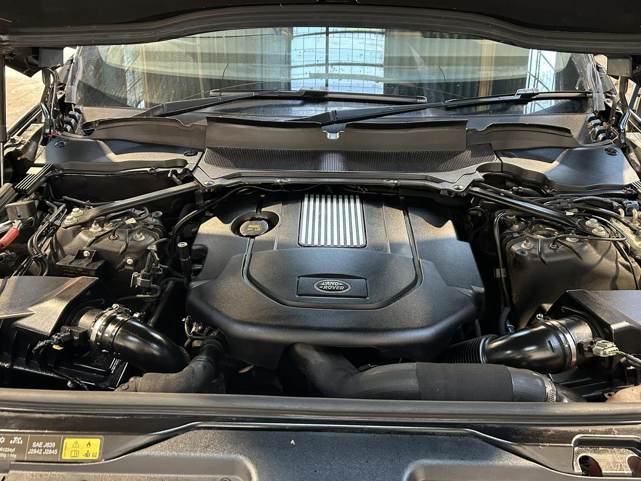 Diagnostics and fault finding​ page image: A Land Rover with its bonnet open. The engine is on show. ASM Independent: Independent Jaguar and Land Rover Specialists Wakefield.